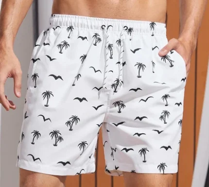 "Men’s white summer shorts featuring vibrant sublimation prints, designed for comfort and style, displayed in an outdoor setting, ideal for warm weather activities."